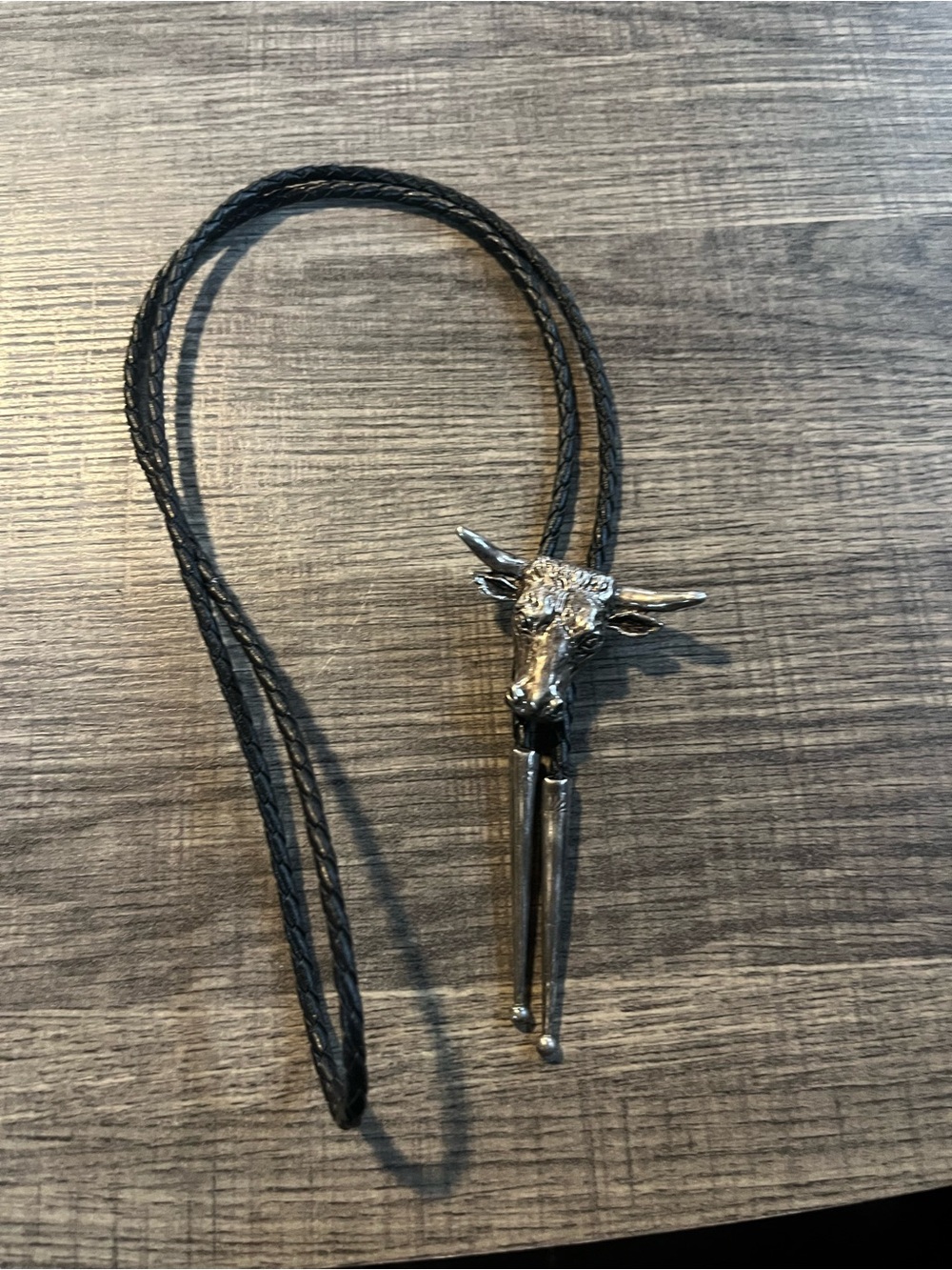 Sterling Silver Western Bull Head Bolo Tie on leather cord. Sterling tips.